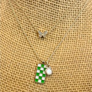 Elegant Gold Necklace with Green Checkered Pendant and Butterfly Charm
